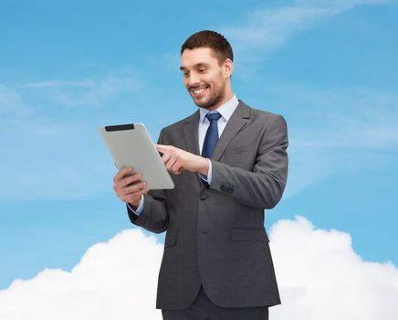 business and technology concept - smiling businessman with tablet pc computer