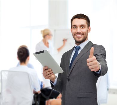 business, communication, modern technology and office concept - smiling buisnessman with tablet pc computer showing thumbs up