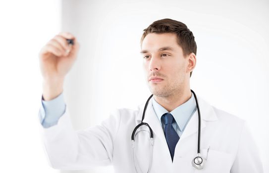 healthcare, medical and technology - young doctor working with something imaginary