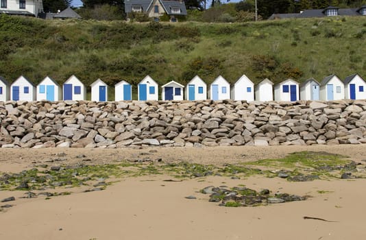 Beach cabins on the hill in Normandy, France