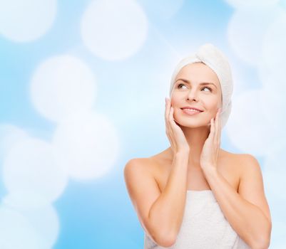 health, spa and beauty concept - beautiful woman in towel