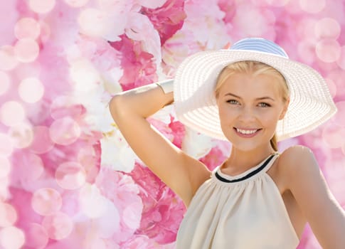 fashion, happiness and lifestyle concept - beautiful woman in hat enjoying summer outdoors