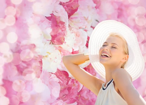 fashion, happiness and lifestyle concept - beautiful woman in hat enjoying summer outdoors