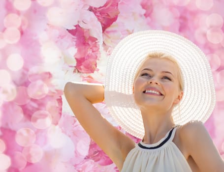 fashion, happiness and lifestyle concept - beautiful woman in hat enjoying summer outdoors