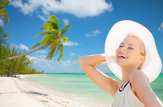 fashion, happiness and lifestyle concept - beautiful woman in hat enjoying summer outdoors