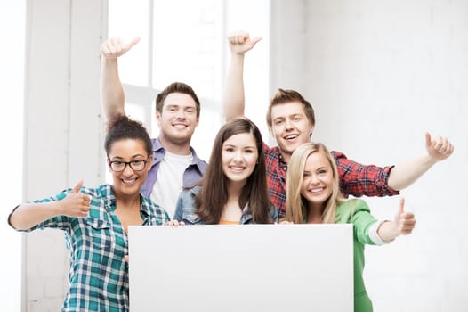 education concept - group of students at school with blank white board