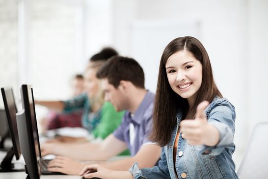 education, technology and internet - student with computers studying at school