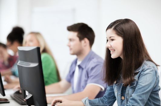 education, technology and internet - students with computers studying at school