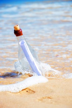 Bottle with a message. Beach and ocean.