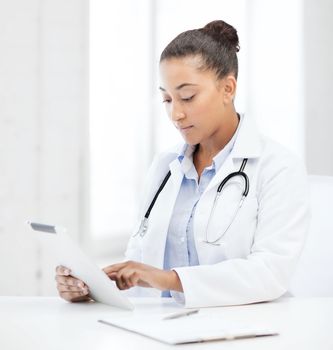 healthcare, medical and technology concept - african female doctor with tablet pc