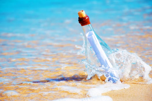 Bottle with a message. Beach and ocean.