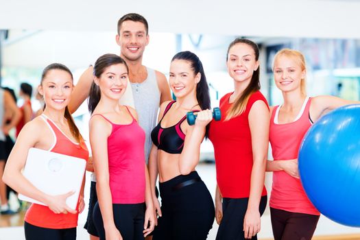 fitness, sport, training, gym and lifestyle concept - group of smiling people in the gym