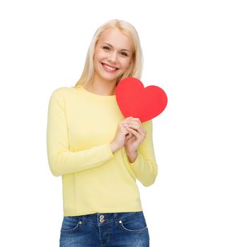 happiness, health and love concept - smiling woman with red heart