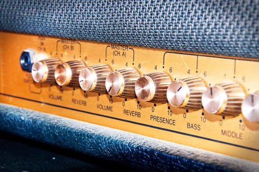 Sound volume controls of vintage guitar amplifier. Music and sound conceptual image.