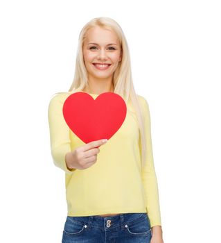 happiness, health and love concept - smiling woman with red heart