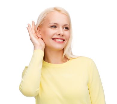 gossip, communication and people concept - smiling young woman listening to gossip