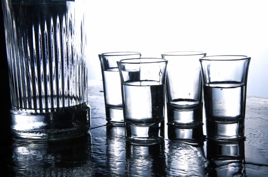 Alcohol conceptual image. Glasses of pure vodka.