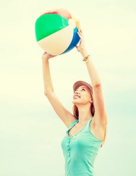 summer holidays, vacation and beach activities - girl playing ball on the beach