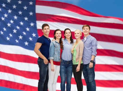 education and people concept - group of smiling students standing