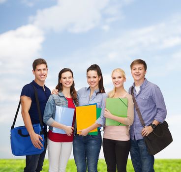 education and people concept - group of smiling students standing