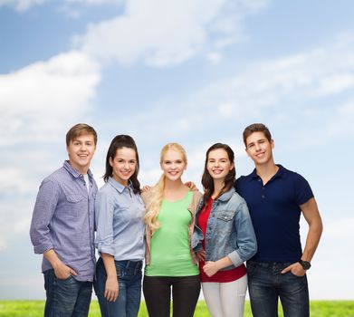 education and people concept - group of standing smiling students