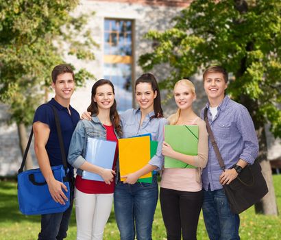 education and people concept - group of smiling students standing