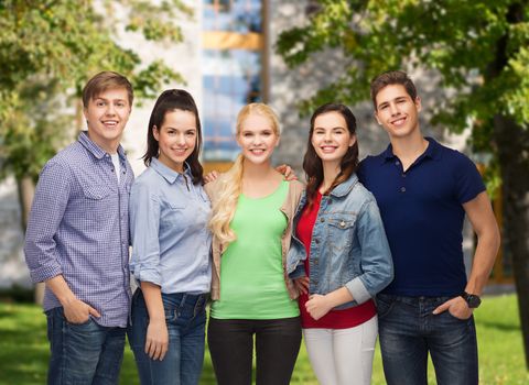 education and people concept - group of standing smiling students