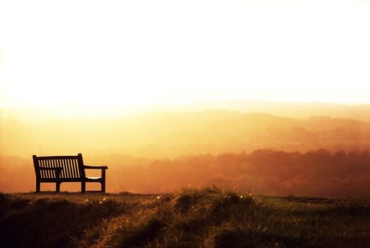 Alone bench at sunset.