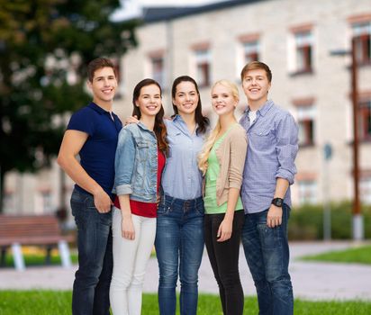 education and people concept - group of smiling students standing