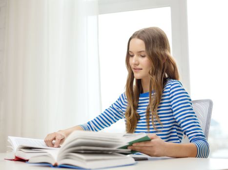 education and home concept - happy smiling student girl with books