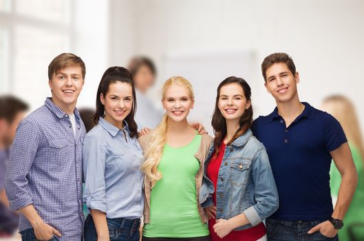 education and people concept - group of standing smiling students