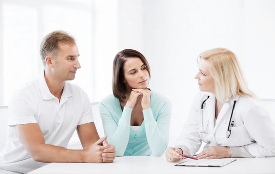 healthcare and medical concept - doctor with patients in cabinet