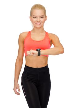 fitness, technology and exercising concept - smiling woman with heart rate monitor on hand