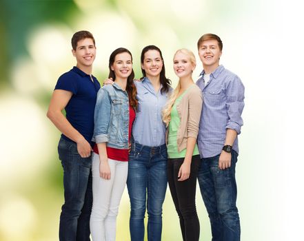 education and people concept - group of smiling students standing