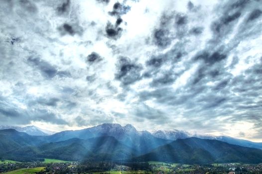 Clouds over Tatra mountains and Zakopane city. Nature Landscape.