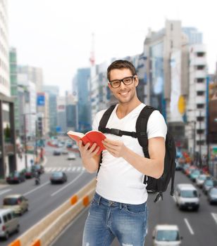 travel, vacation and education concept - travelling student with backpack and book