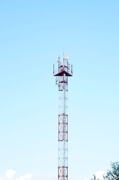 High iron cell tower on a background of blue sky