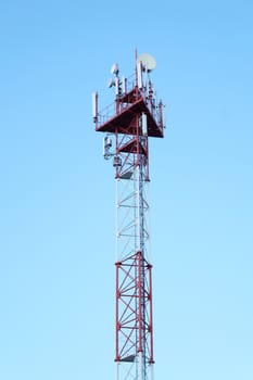 High iron cell tower on a background of blue sky