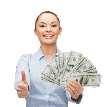 business and money concept - young businesswoman with dollar cash money showing thumbs up