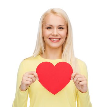 happiness, health and love concept - smiling woman with red heart