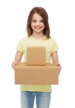 post office, transportation and people concept - smiling little girl with many cardboard boxes