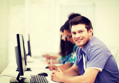 education concept - student with computer studying at school