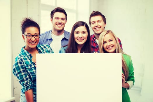 education concept - group of students at school with blank white board