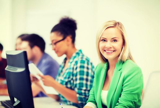 education concept - student girl with computer studying at school