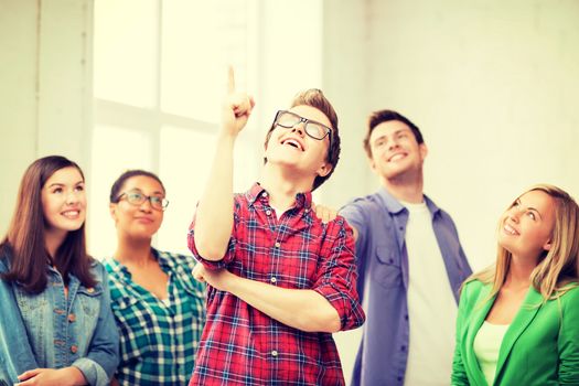 education concept - student boy with group of students at school