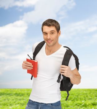 travel, vacation and education concept - travelling student with backpack and book