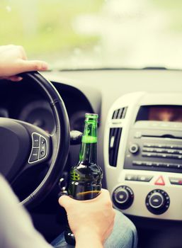 transportation and vehicle concept - man drinking alcohol while driving the car