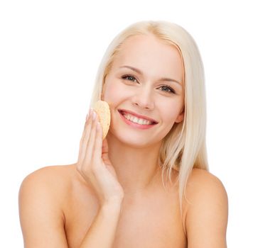 health, beauty and spa concept - beautiful woman with sponge