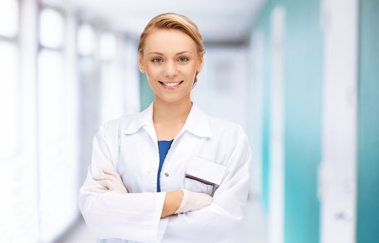 medicine and healthcare concept - attractive female doctor in hospital