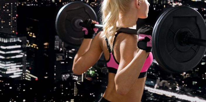 fitness, sport and dieting concept - sporty woman exercising with barbell from back